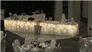 Lighted wedding cake station with two tables